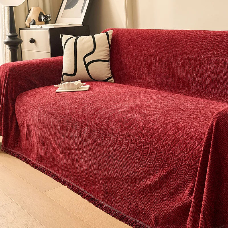 Couverture canapé avec pompon rouge
