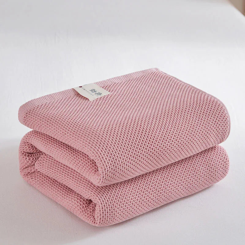 Couverture à carreaux en coton rose