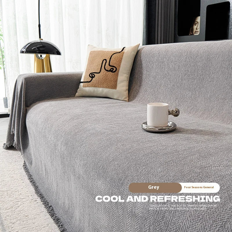 Couverture canapé avec pompon gris