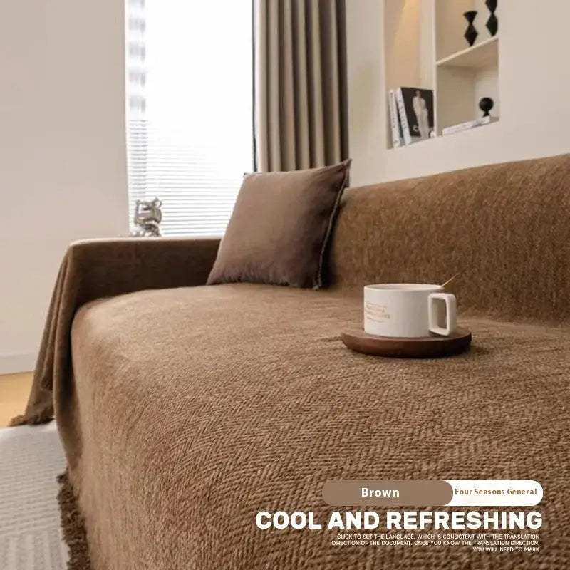 Image of Couverture canapé avec pompon marron style cosy – intérieur chaleureux