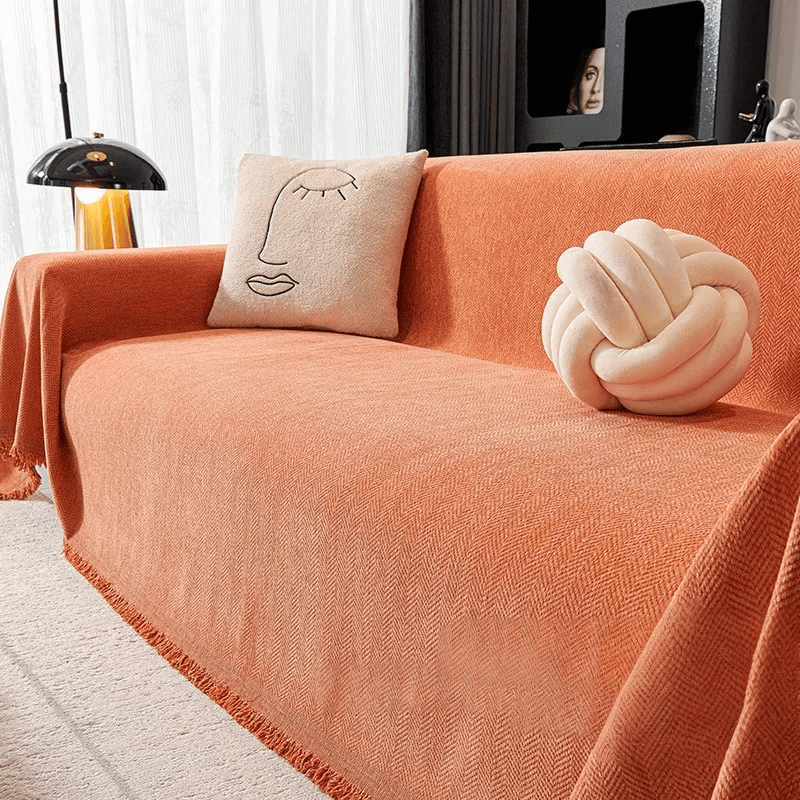Couverture canapé avec pompon orange 1