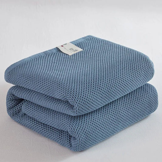 Couverture à carreaux en coton bleu