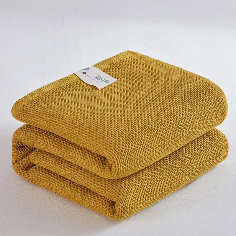 Couverture à carreaux en coton jaune