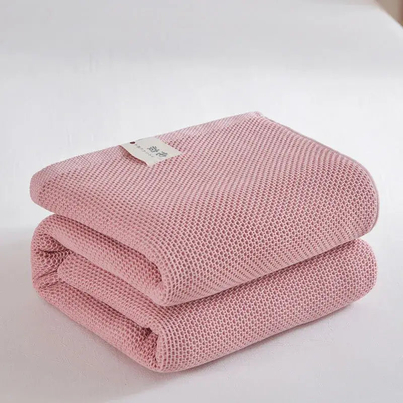 Image of Couverture à carreaux en coton rose– chauffage naturel et style cosy