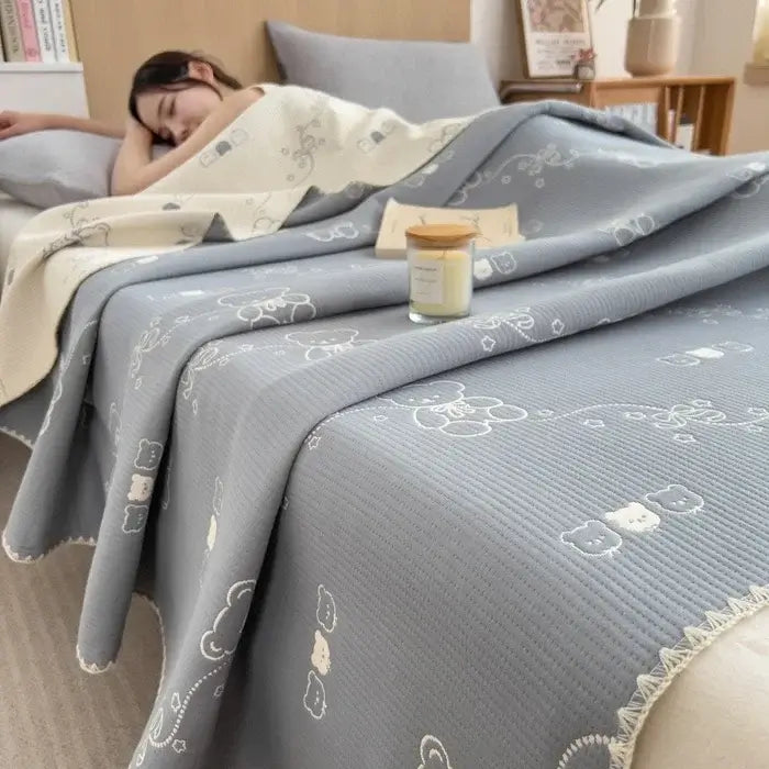 Image of Couverture en jacquard coton bleu gris